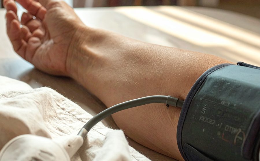 Person checking blood pressure at home